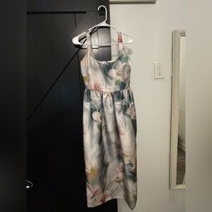 Floral style Kenzie dress. Grey backdrop with blue and pink flowers.